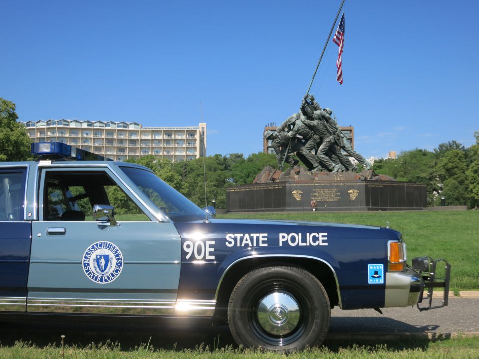 Close side view of Massachusetts State Police Ford sedan with push bar near Iwo Jima Memorial
