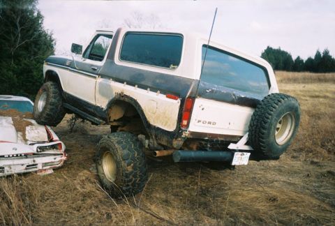 1978 Ford Bronco - This 1978 Ford Bronco is seen in a junkyard, partially crushing another vehicle.