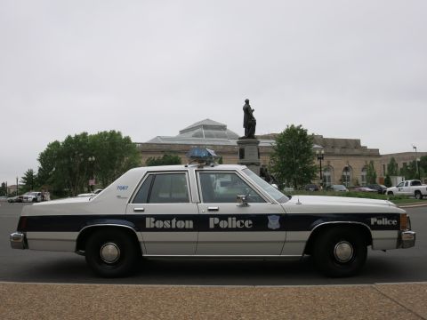 1991 Ford LTD Crown Victoria - white-and-blue Ford full-size Boston Police sedan parked before a large domed stone building with a statue.