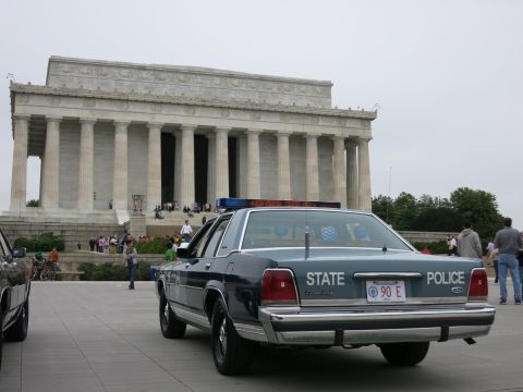 1991 Ford LTD Crown Victoria - Rear view of a blue Ford STATE POLICE sedan with plate 90 E parked in front of the Lincoln Memorial.