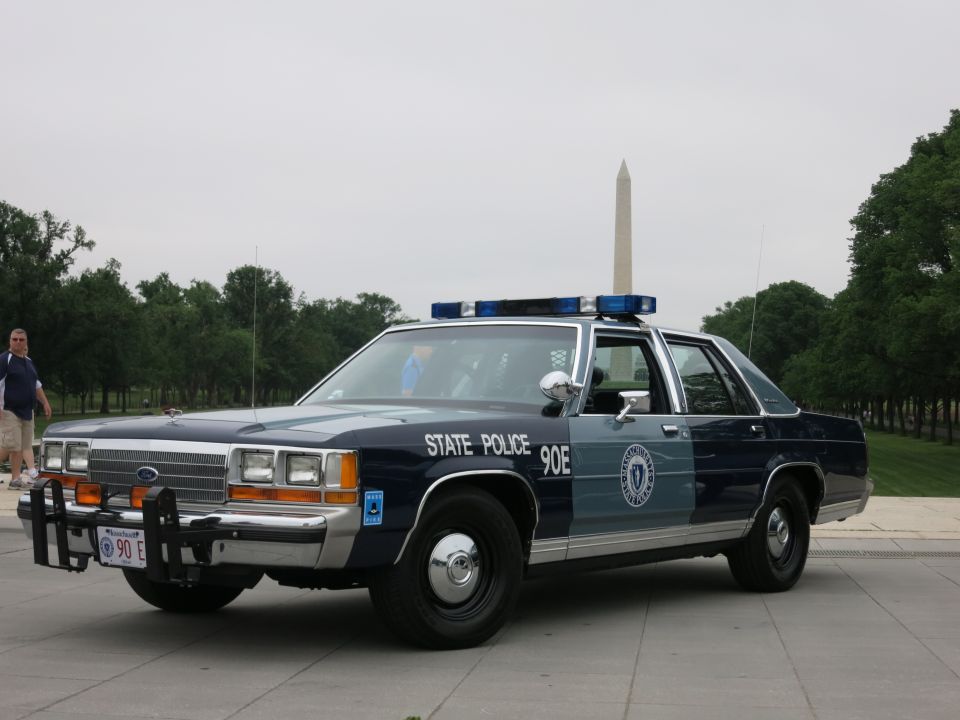 Blue and silver State Police Ford patrol sedan front quarter, Washington Monument