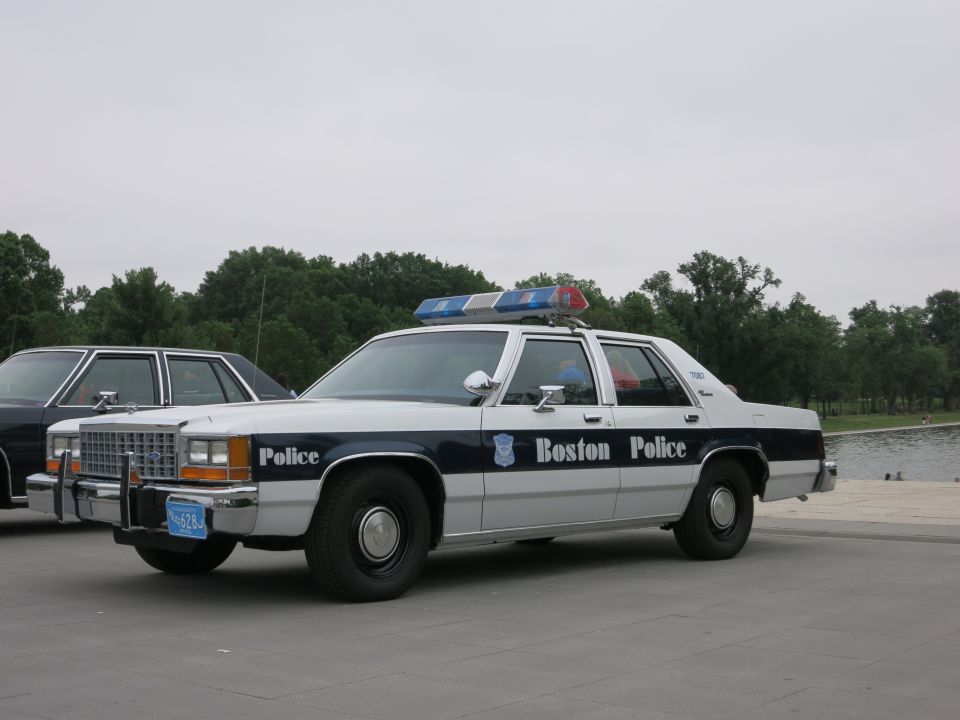 Boston Police Ford sedan with light bar parked beside another cruiser