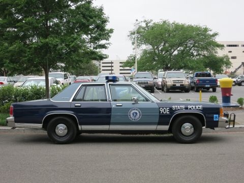 Two-tone State Police Ford LTD Crown Victoria sedan side view, unit 90E