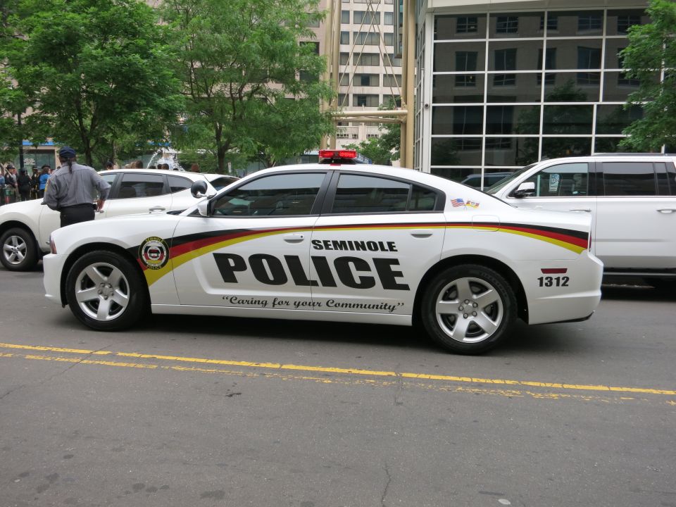 White Seminole Police Dodge Charger sedan parked on a city street