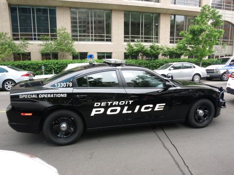 Black Detroit Police Special Operations Dodge Charger parked in profile