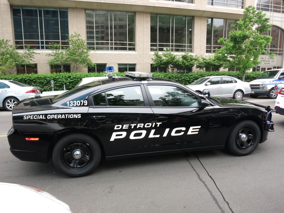 Black Detroit Police Special Operations Dodge Charger parked in profile