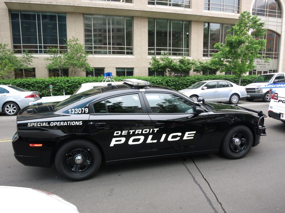 Side view of black Detroit Police Special Operations Dodge Charger unit 133079