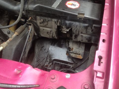 1992 Ford F-150 - Engine bay components are visible, including an air intake and a black plastic housing with a K&N sticker.