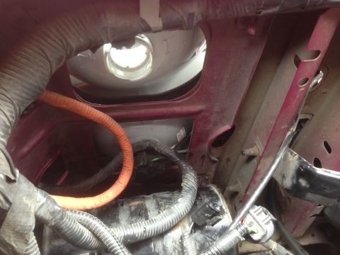 1992 Ford F-150 - Close-up view of wiring and components within a vehicle's engine bay.