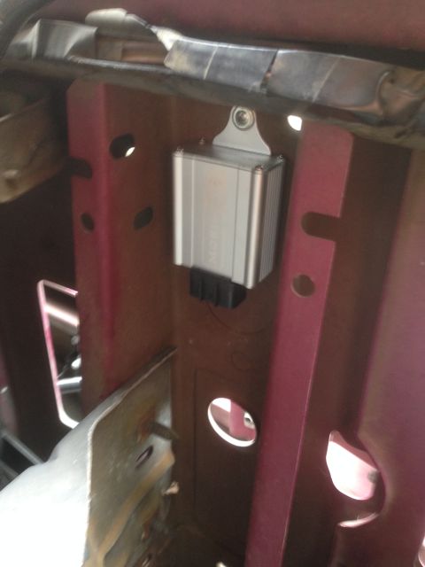 1992 Ford F-150 - A silver ballast for HID headlights is mounted to the vehicle's frame, likely for a projector retrofit.