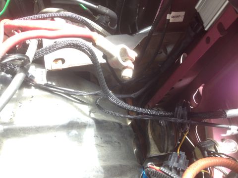 1992 Ford F-150 - Close-up view of wiring and components in a vehicle's engine bay.
