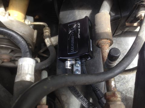 1992 Ford F-150 - A Morimoto 3Five LC ballast is visible, mounted among hoses and engine components.