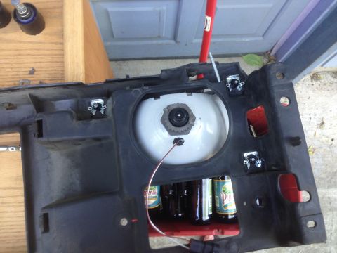 1992 Ford F-150 - A vehicle headlight assembly is shown with several beer bottles visible beneath it, and a Supermotors.net watermark.