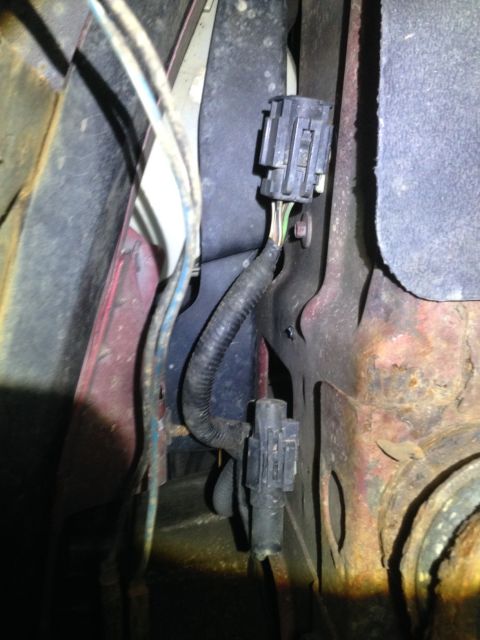 1995 Ford Bronco - Noticed this harness today and wondered what it's for. It's capped and has multiple wires. It s located below the Driver's side head light.…