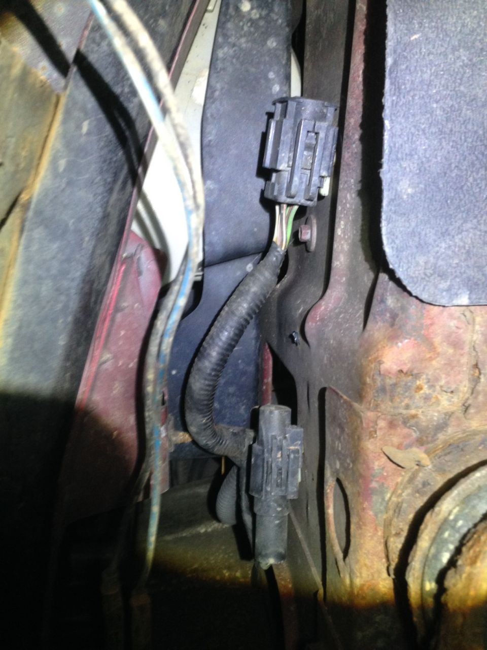Noticed this harness today and wondered what it's for. It's capped and has multiple wires. It s located below the Driver's side head light. It is right next to my temp sensor for the overhead console.