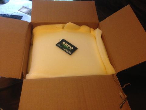 1992 Ford F-150 - A DEPO brand card is placed on foam padding within an open cardboard box.