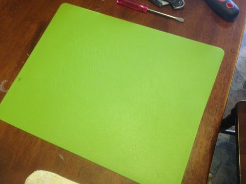 1992 Ford F-150 - A green mat is placed on a wooden table, with tools visible in the background.