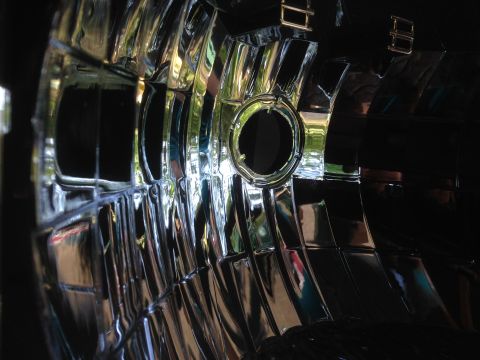 1992 Ford F-150 - Headlight reflector detail, showing complex internal surfaces and a mounting point.
