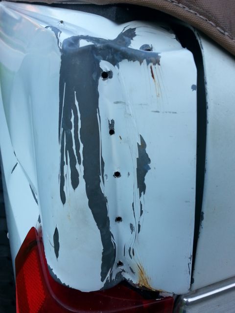 1992 Ford Bronco - Drilled holes along the crease. I've tried with a small dent puller to budge this, but no luck. I may have to make a cut on the inside and…