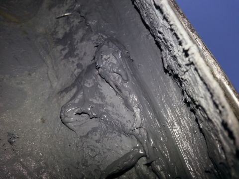 1992 Ford Bronco - Thick underbody sealant is visible in this close-up shot.