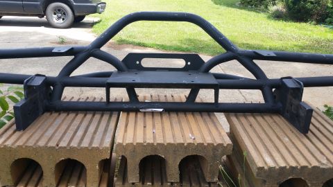 1988 Ford Bronco - A heavy-duty aftermarket bumper designed for off-road use is displayed outdoors.