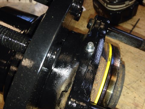 1993 Ford Bronco - Wheel hub assembly part with a grease fitting and yellow seal visible.