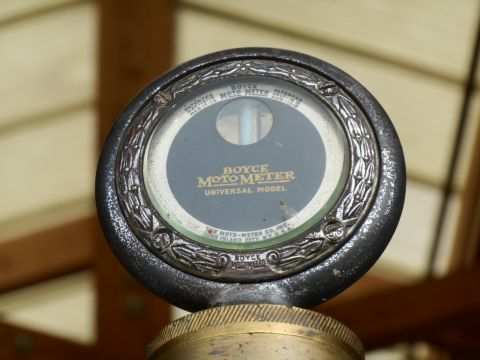 1994 Ford Bronco - A Boyce Moto-Meter radiator cap gauge, labeled 'Universal Model', with patent information visible.