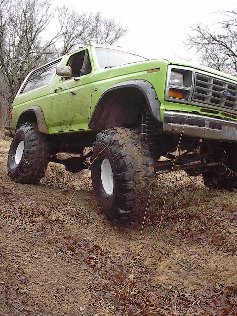 1986 Ford Bronco - Crossing a deep wash out. Twisted my body and crimped the passenger door on this one.