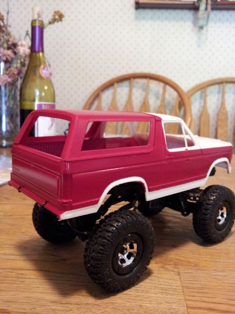 1995 Ford Bronco - This toy Bronco features a two-tone red and white paint scheme and oversized off-road tires.