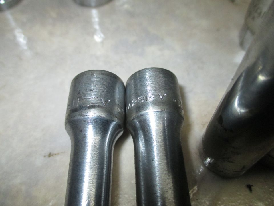 Close-up of two socket wrenches with visible markings