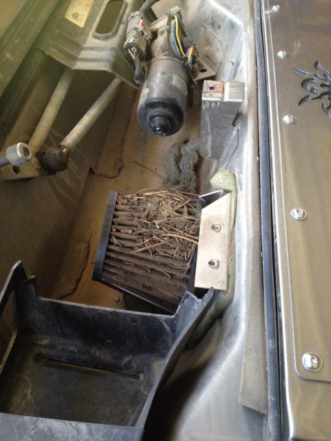 2005 Jeep Wrangler - Air filter packed with debris, likely causing airflow issues.