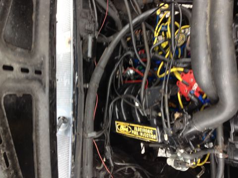 1988 Ford Bronco - The engine bay features a "Ford ELECTRONIC FUEL INJECTION" label, consistent with a 1988 model.