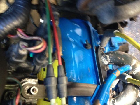 1988 Ford Bronco - Wiring harnesses and connectors are visible in the engine bay, with a bright blue component in the center.