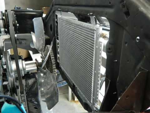 1979 Ford Bronco - Close-up view of a radiator and fan assembly, likely part of an engine bay.