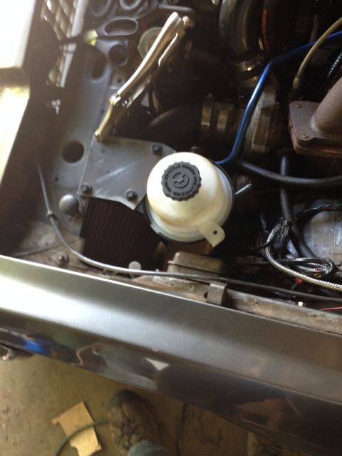1981 Ford LTD - The top piece of steel is now cut out so I can hold the reservoir steady while I mark and trim the cardboard for the lower bracket. The ste…