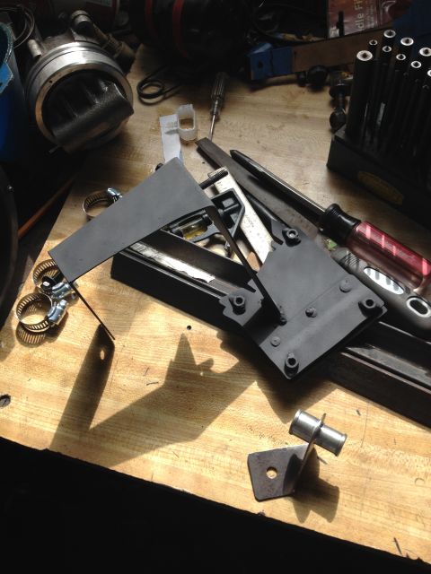 1981 Ford LTD - Both brackets. The big bracket holds the reservoir and the smaller holds the 5/8" to 3/4" adapter for the hoses. The pump has a 5/8" nipple…