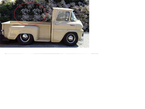 1973 Ford Ranchero - Side view of a vintage Ford Econoline pickup truck, likely from the early 1960s.