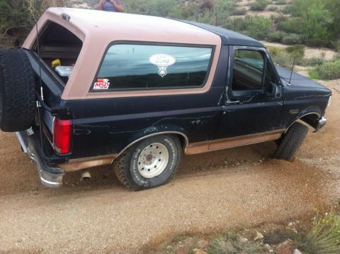 1994 Ford Bronco - This 1994 Ford Bronco is seen off-road, equipped with a spare tire mounted on the rear.