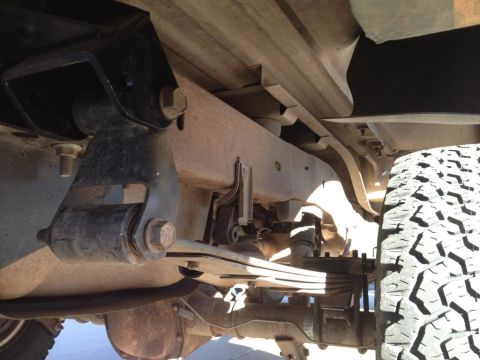 1994 Ford Bronco - Undercarriage view of a truck, showing suspension and tire details.