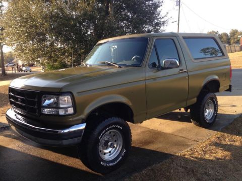 1994 Ford Bronco - This 1994 Ford Bronco is shown in a 3/4 front view, painted an olive green color.