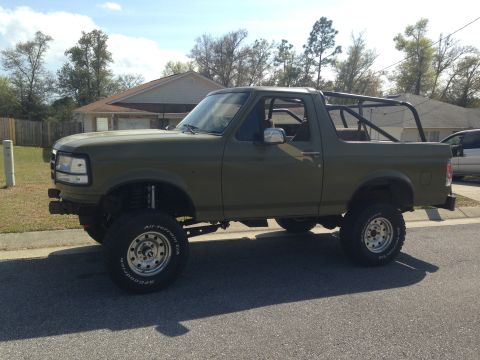 1994 Ford Bronco - This modified 1994 Ford Bronco features a lifted suspension and a custom roll cage for off-road use.