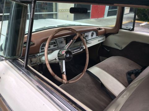 1968 Ford Mustang - The interior of a 1958 Mercury Montclair features a two-tone dashboard and seats, along with a classic steering wheel.