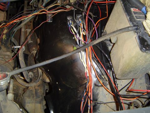 1989 Ford Bronco - A complex vehicle wiring harness with numerous colorful wires is visible in this close-up shot.