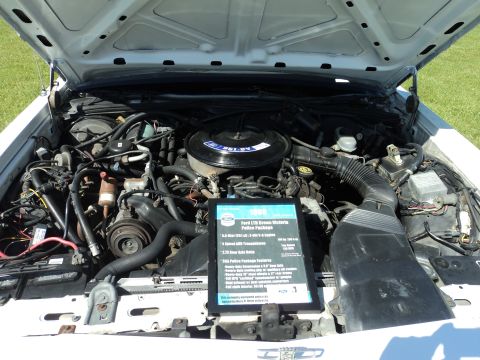 2004 Mercury Grand Marquis - Engine bay of a car a sign about a 1996 Ford LTD Crown Victoria Police Package.