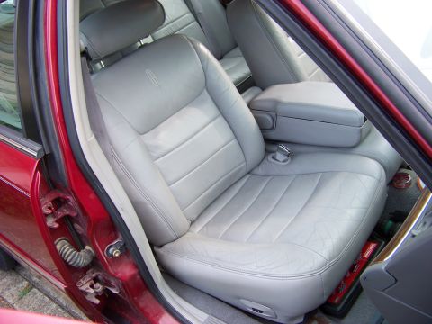 1999 Mercury Grand Marquis - Interior view of a car's front seats and center console.