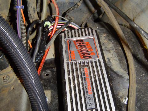 1989 Ford Bronco - Close-up of an MSD 6 OFFROAD ignition control module and associated wiring.