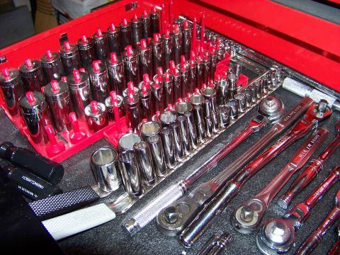 1995 Mercury Grand Marquis - A red tool chest is filled with a variety of sockets and wrenches, along with Craftsman screwdrivers.