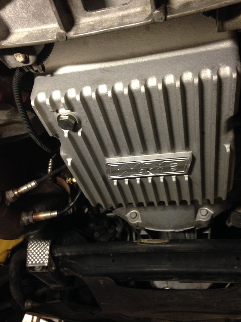 Silver transmission pan with 'Magna' logo
