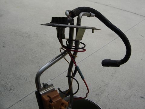 1996 Ford Bronco - Fuel pump assembly, likely for an older vehicle, shown with electrical connectors and fuel lines.