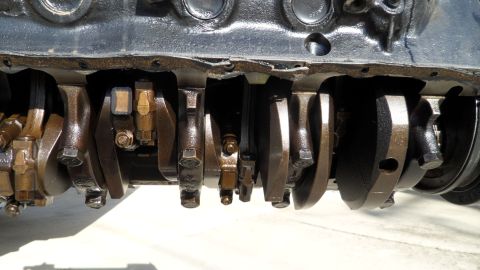 1972 Ford Ranchero - Close-up of an engine's crankshaft and connecting rods, showing mechanical components.